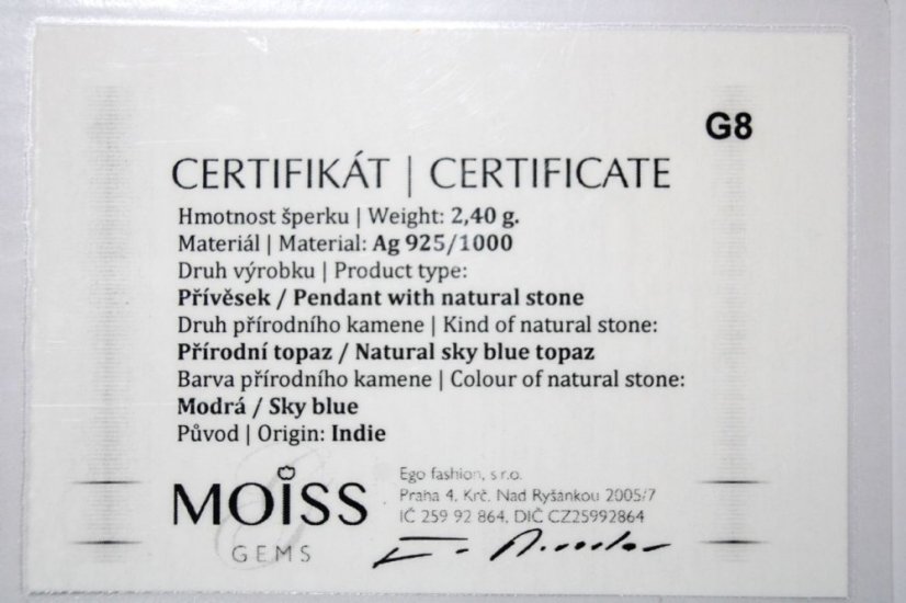 Strieborný prívesok zdobený modrým topásom a čírymi zirkónmi, rhódium, 2,31g, 925/1000