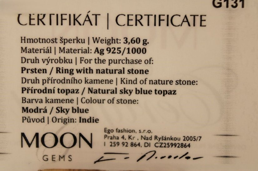 Prsteň- modrý topás- zirkóny- rhódiované striebro