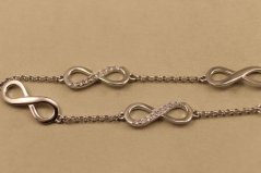 Náramok- nekonečno- číre kamienky- rhódiované striebro