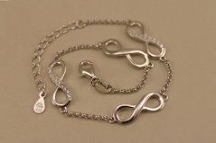Náramok- nekonečno- číre kamienky- rhódiované striebro