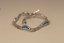 Strieborný polopevný náramok striedavý vzor s modrým opálom, rhodium, 19,5 cm, 10,27g, 925/1000